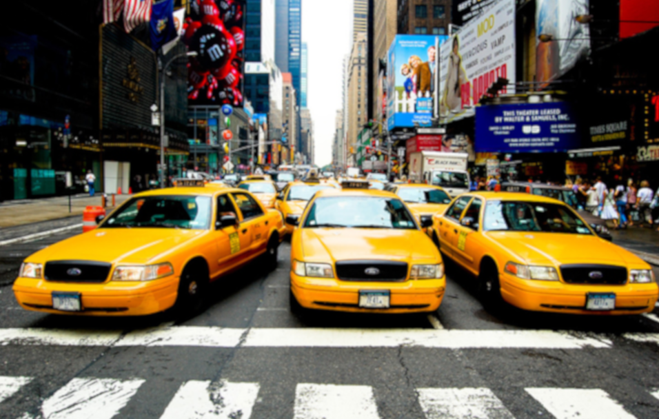 Multiple Taxi Cars In Busy Town